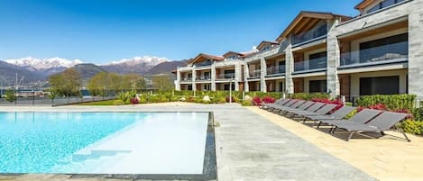 Seasonal outdoor pool, pool umbrellas, pool loungers