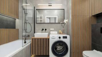 Shower, hair dryer, towels, shampoo