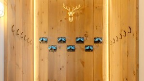 A wooden sauna with a deer head decoration, multiple sauna benches, and a wooden floor. - Stratton; walk on/off, shuttle Rt, pool table, shuffle puck, darts, dogs OK (Winhall)