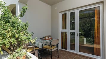 Basic Double Room, Balcony, Partial Sea View | Outdoor dining