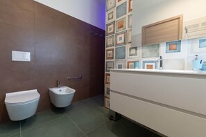 Shower, bidet, soap, toilet paper