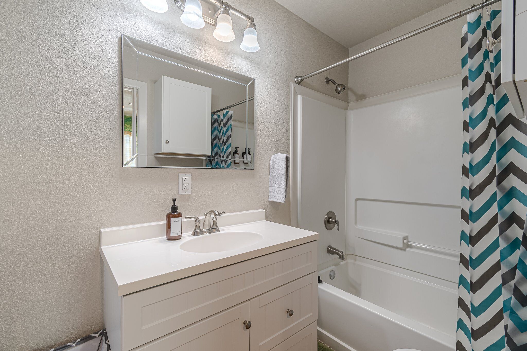 Hair dryer, towels, soap, shampoo