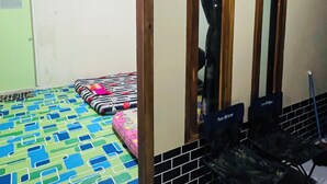 A room with a bed, a mirror, a door, and a chair. - Bintang Sawarna 2 By ARBA (Bayah)