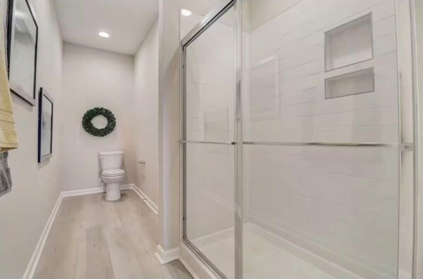 Shower, hair dryer, towels, soap