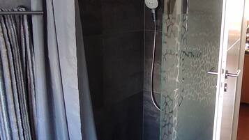 Shower, hair dryer, towels, toilet paper