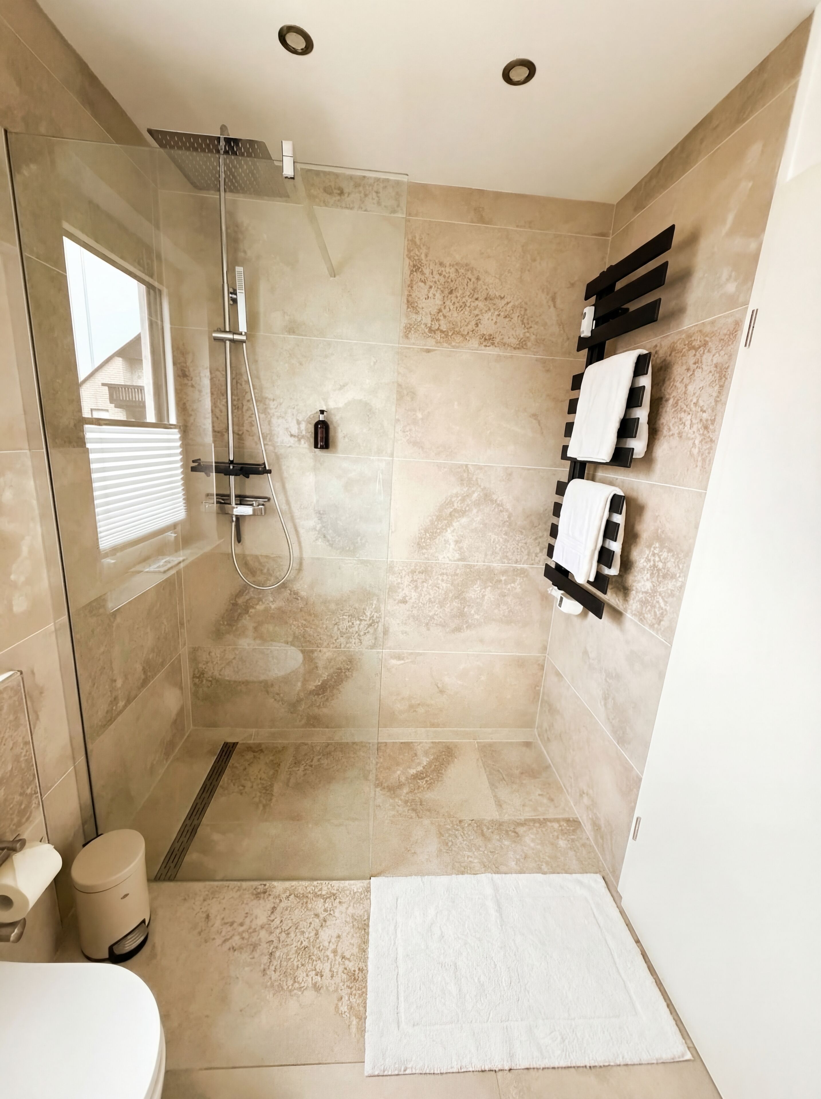 Shower, hair dryer, towels, toilet paper