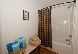 Shower, hair dryer, towels, toilet paper