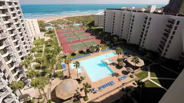 A high-rise hotel with a swimming pool, tennis courts, and a beach view. - Beachfront Saida condo with Gulf views, resort pools, room for 6 and a $75 beach gear rental credit. (South Padre Island)