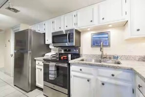 Fridge, microwave, oven, stovetop - Beachfront condo with Gulf views, pool, hot tub, and beach access (South Padre Island)