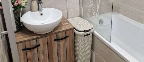 Shower, hair dryer, towels, toilet paper