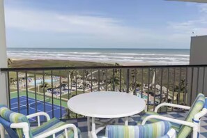 Outdoor dining - Spacious beachfront corner condo with Gulf views, 3 pools & hot tubs! (South Padre Island)