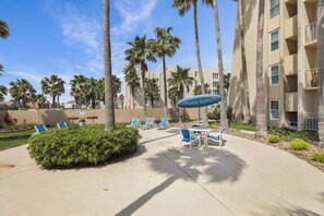 Outdoor dining - Beachfront 3BR condo with Gulf views, pool, hot tub & beach patio! (South Padre Island)