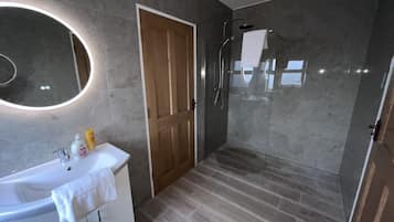 Shower, hair dryer, towels, soap