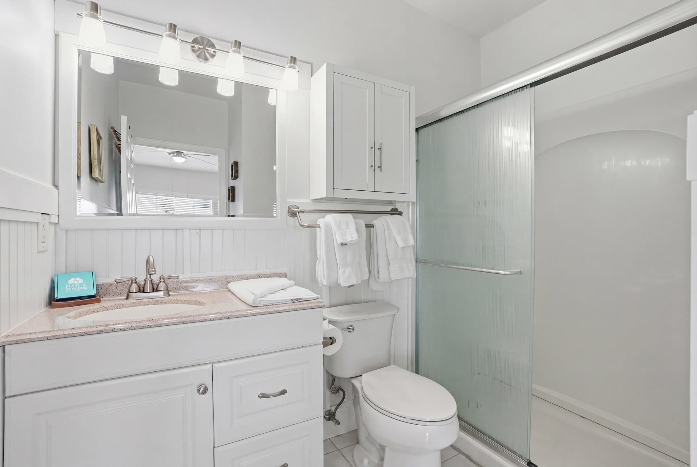 Shower, hair dryer, towels, shampoo