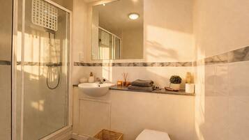Shower, hair dryer, towels, soap