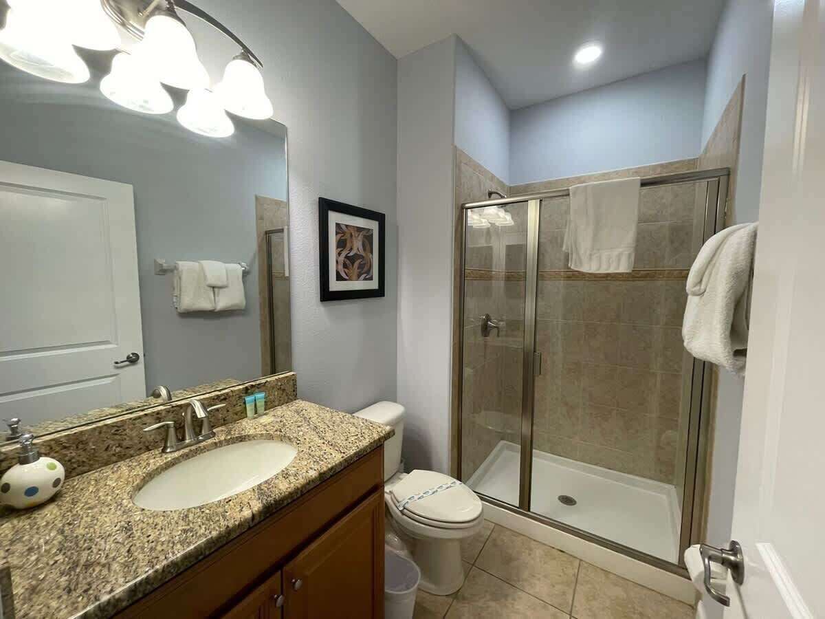 Shower, hair dryer, towels, shampoo