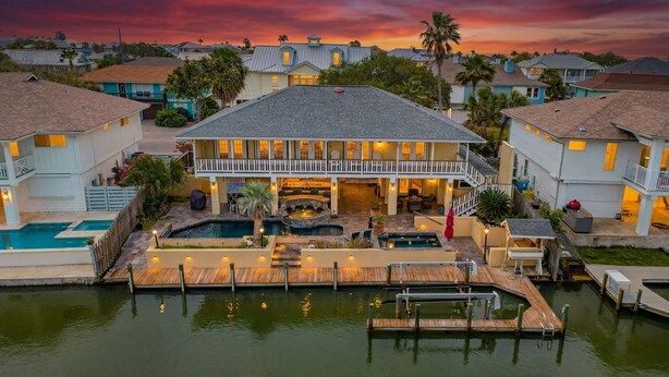 A large house with a pool, a hot tub, and a deck area. - Waterfront Retreat w/ Pool, Dock & Fire Pit (Rockport)