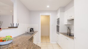 Fridge, microwave, oven, stovetop - Sandcastles 1, 8 Ala Moana Way - air conditioned townhouse with Wi-Fi and Complex Pool (Fingal Bay)