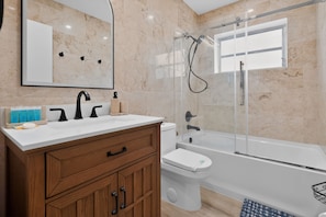 Shower, hair dryer, towels, soap