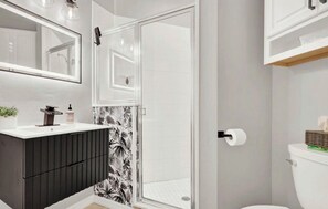 Shower, jetted tub, towels, soap