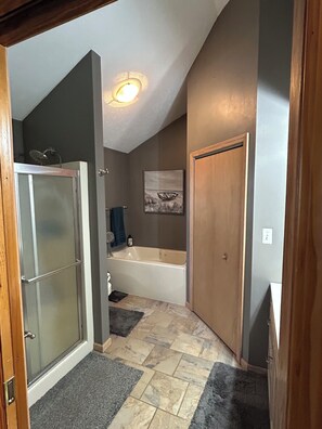 Jetted tub, hair dryer, towels, toilet paper
