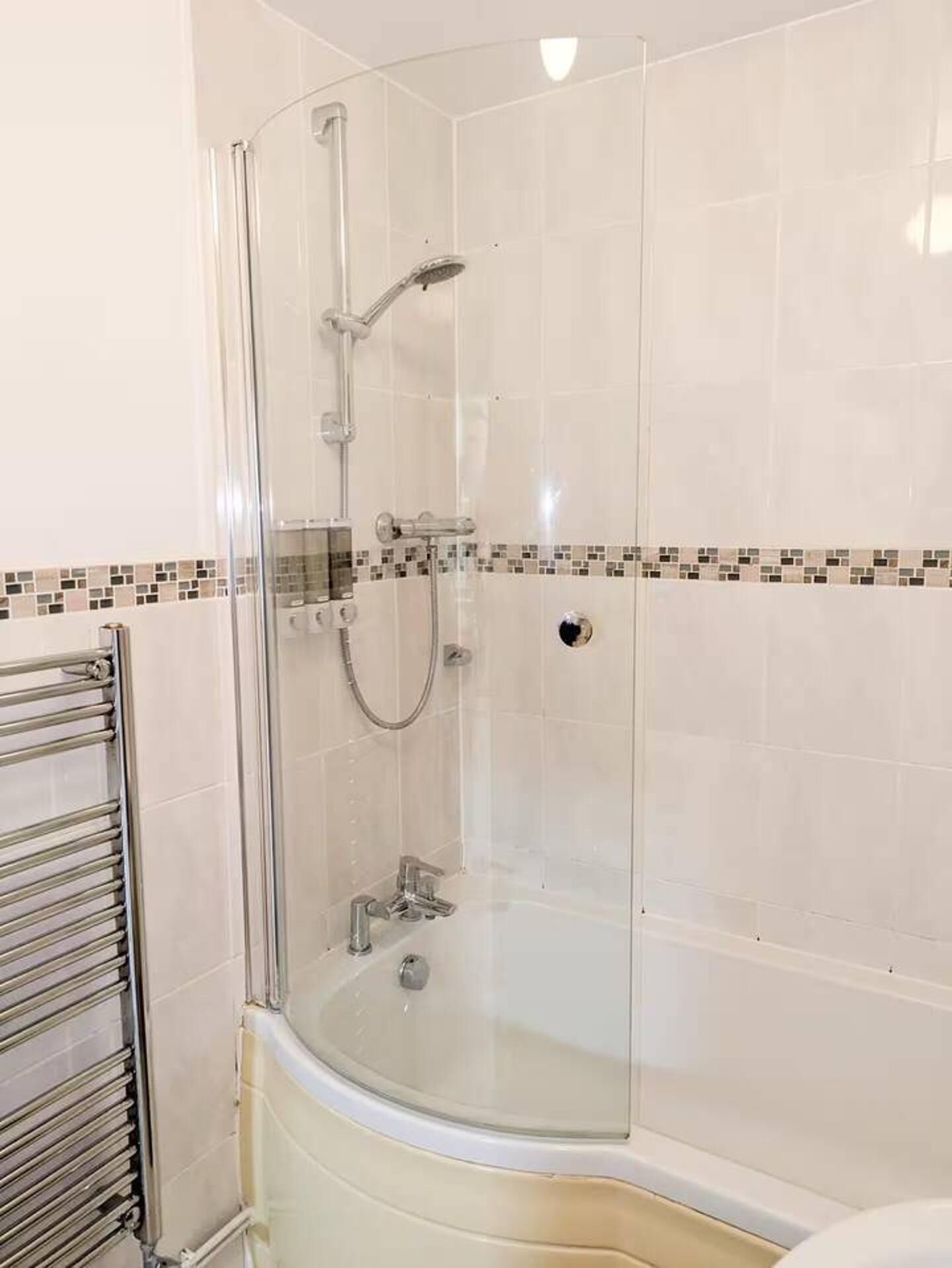 Combined shower/bathtub, deep-soaking bathtub, hair dryer, towels