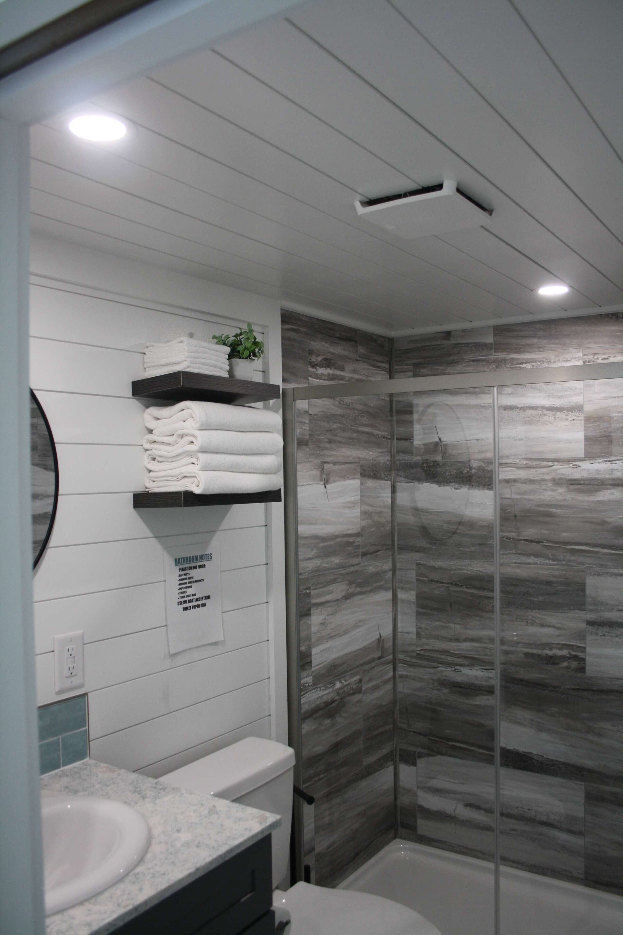 Shower, hair dryer, towels, shampoo