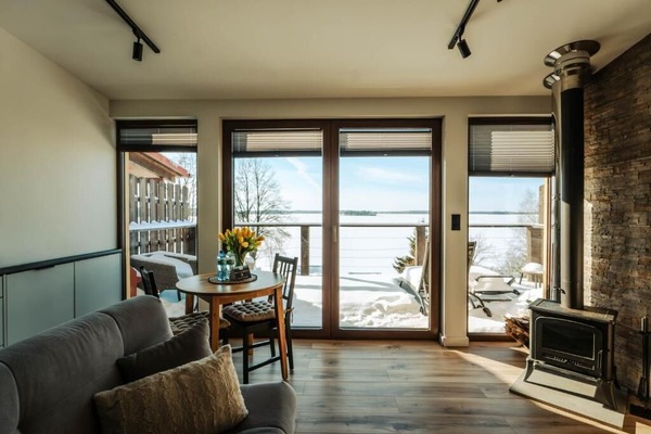 Comfort Apartment, Balcony, Lake View | Living area | Flat-screen TV, fireplace