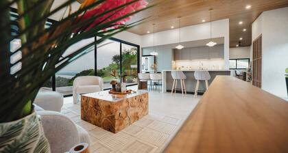Modern adults-only villa with private plunge pool and panoramic ocean-to-mountain views.