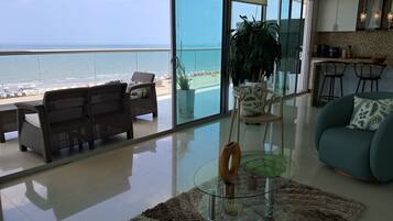Deluxe Apartment, Balcony, Beach View | Living area