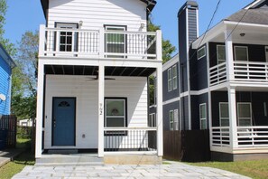 A two-story building with a front porch, a blue door, and a number '962' on the wall. - New -Atlanta Gem-Close to Mercedes-Benz (World Cup), World Congress Center & State Farm (Atlanta)