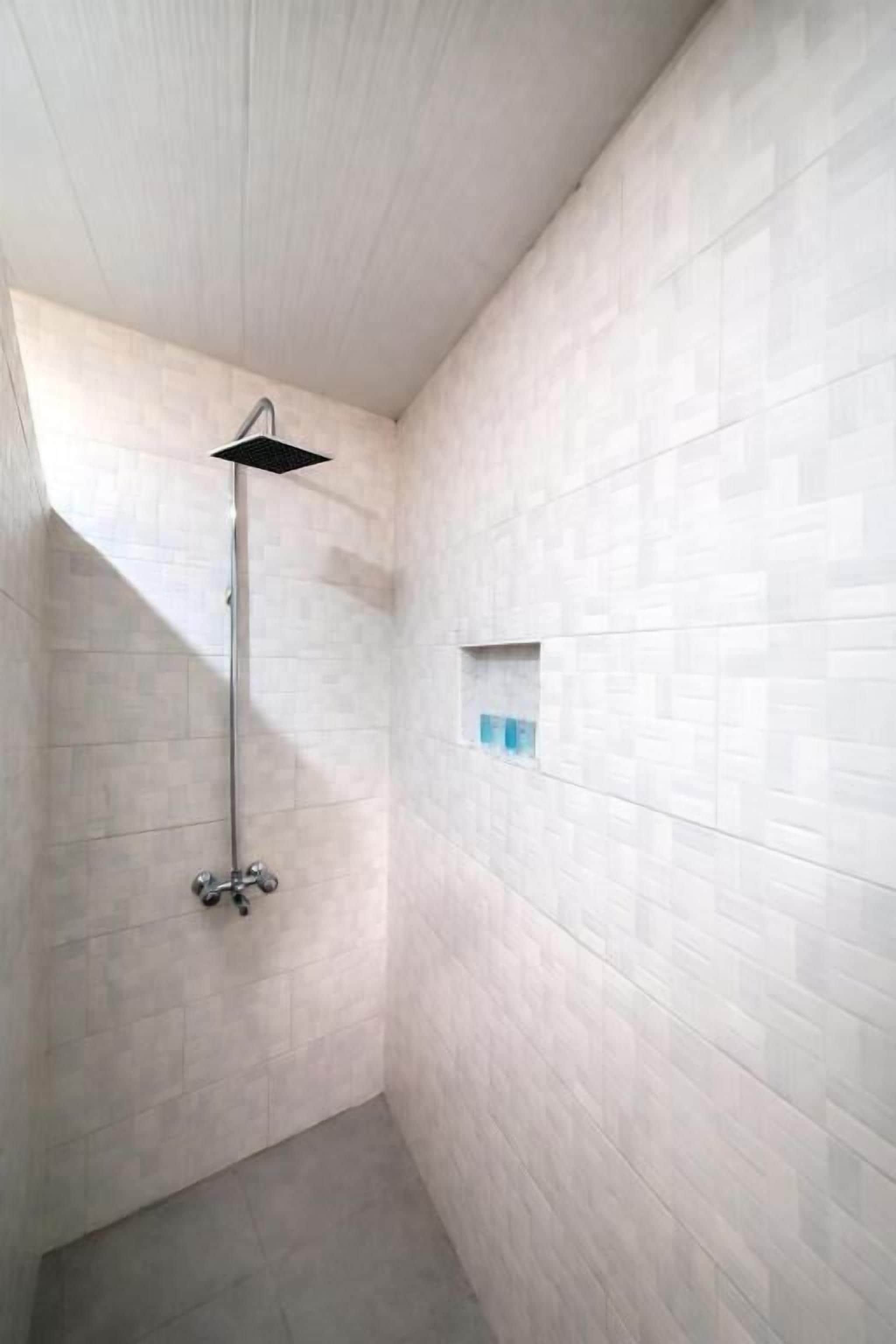 Shower, free toiletries, slippers, towels