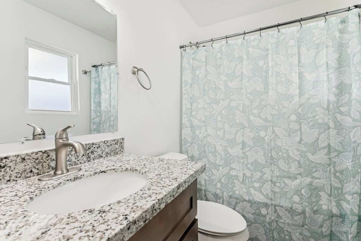 Shower, hair dryer, towels, shampoo