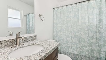 Shower, hair dryer, towels, shampoo