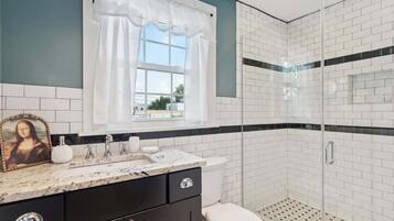 Shower, hair dryer, towels, shampoo