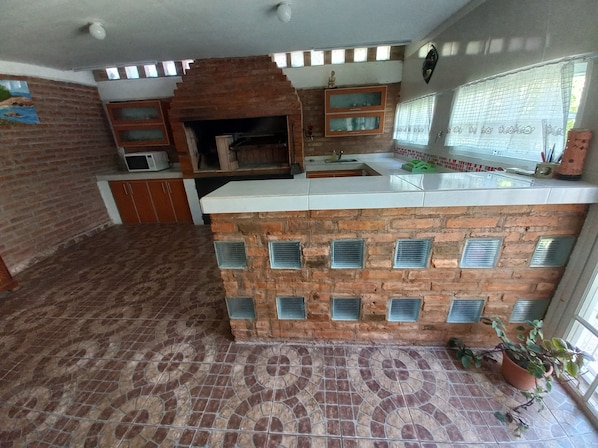 Private kitchen - House Quincho in Plottier (Plottier)