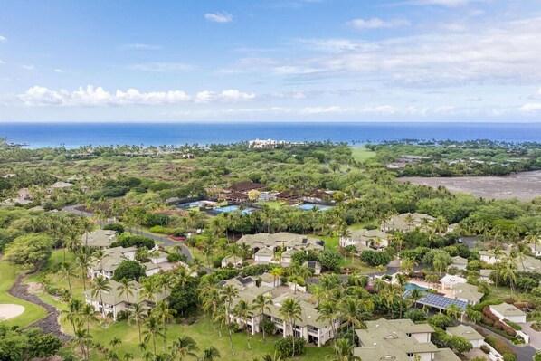 A resort with multiple buildings, a golf course, and a large body of water. - Newly Refreshed Luxury Villa End Unit at The Islands at Mauna Lani M4 (Waimea)