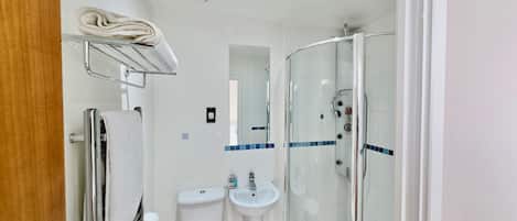 Shower, towels, soap, toilet paper