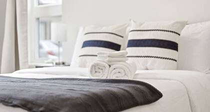 2BR Modern Condo | High Ceilings, Ensuite & Patio