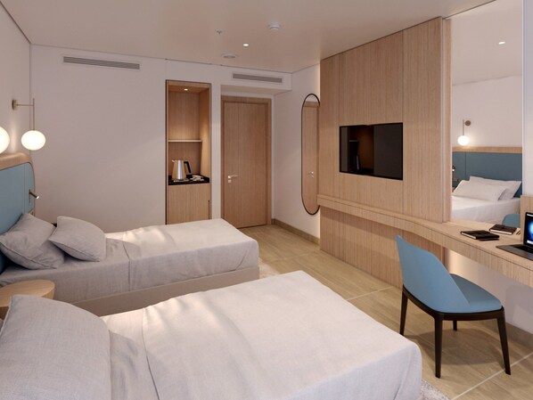 A hotel room with two beds, a desk, a TV, and a minibar. - Holiday Inn Resort Bodrum West Beach By Ihg (Bodrum)