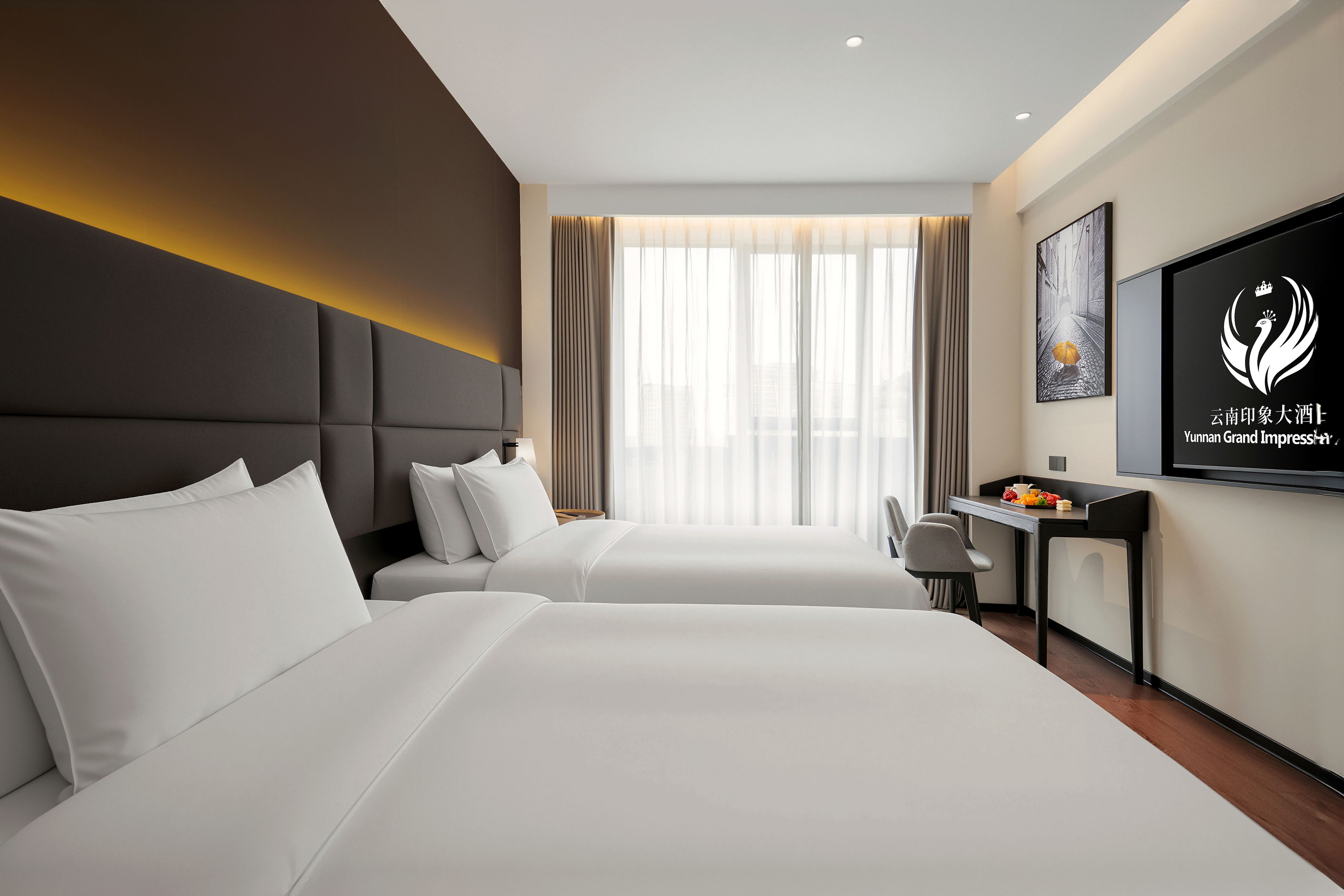 A hotel room with two beds, a desk, a chair, a TV, and a window with curtains.