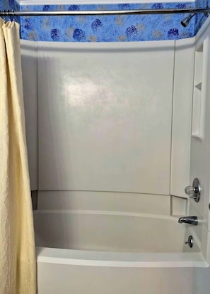 Shower, hair dryer, towels, shampoo