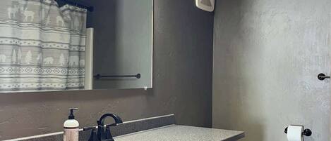 Upstairs bathroom with bathtub and shower