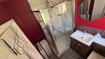 Shower, towels, soap, toilet paper