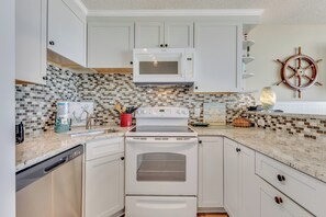 Fridge, microwave, oven, stovetop - Experience comfort at 0412 Memories Made At The Beach, a cozy oceanfront retreat in Carolina Beach. (Carolina Beach)