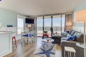 TV, books - Relax in this premier beachfront 1-bedroom condo in Carolina Beach. (Carolina Beach)