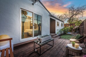A patio with a table, chairs, and a grill. - Chic 3BR Hollywood Escape w/ Pool + Private Patio (Los Angeles)