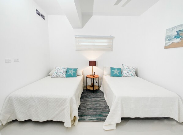 2 bedrooms, iron/ironing board, WiFi, bed sheets - 2-bedroom condo in lovely Playa Juan Dolio with AC and fitness room (Playa Juan Dolio)