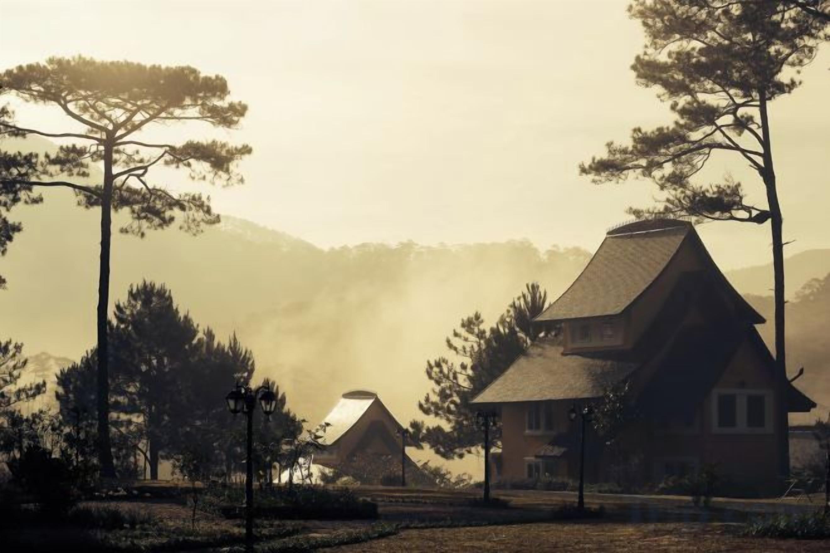A traditional house with a thatched roof, surrounded by trees and a misty background.