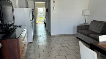 Family Suite, 1 Bedroom, Kitchenette | Living area | TV
